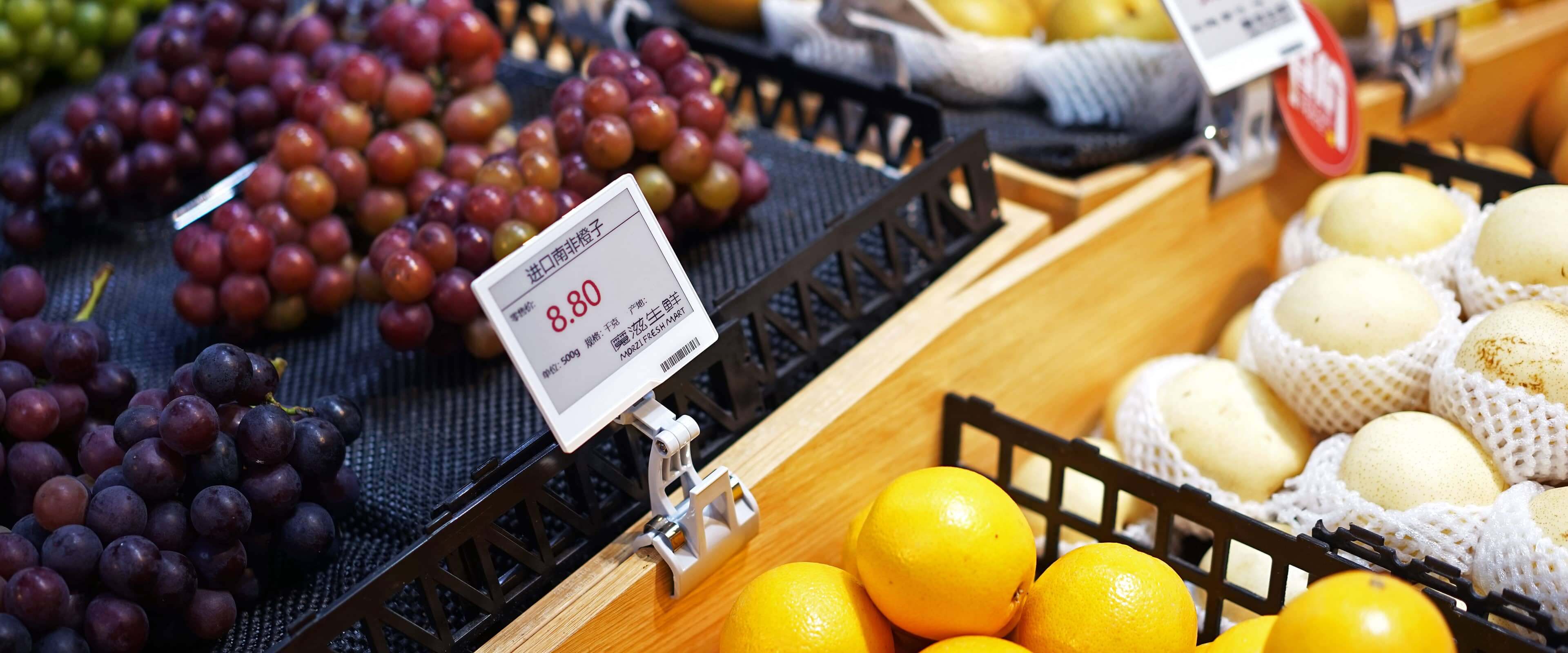 ESL electronic shelf label showing real-time pricing on fresh produce shelf