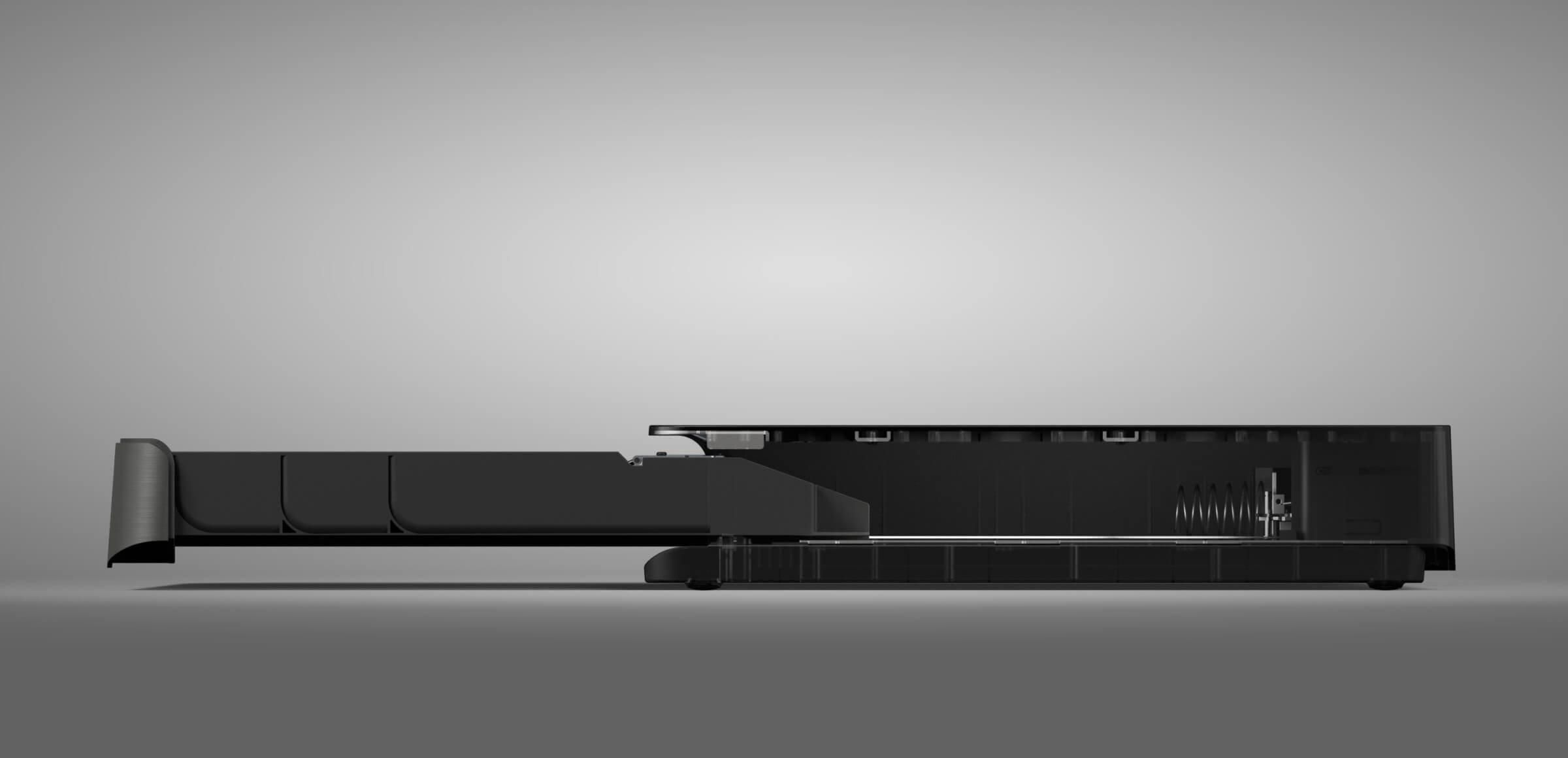 Complete view of the trapezoid-shaped MAX cash drawer in black ABS polymer, positioned on its side to showcase robust construction for over 1 million operations.