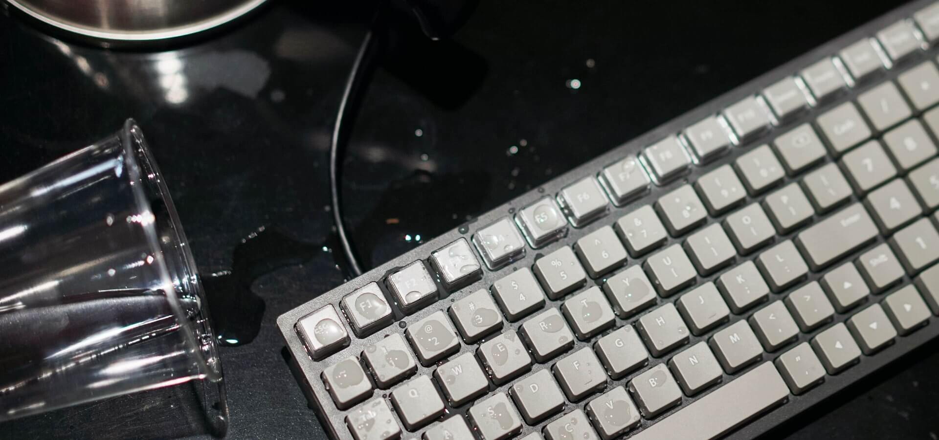 Water spilled on keyboard demonstrating IPX5 resistance